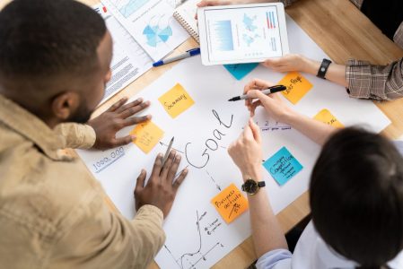 hands-of-analysts-or-brokers-discussing-financial-data-and-making-goals-table.jpg